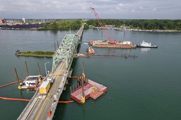 An overhead view of the Grosse Ile Parkway Bridge near Detroit, Michigan, during underwater pier repairs.