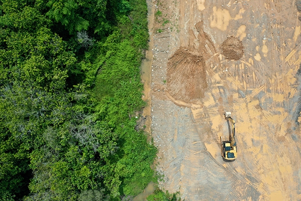An aerial view of mined land. As a site for new infrastructure, mined land has a lot to offer, but potential risks lie hidden underground. Fortunately, targeted geotechnical assessments can uncover a mine’s history and reveal future risks to inform a safe, resilient design.